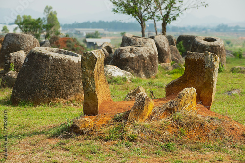 Ancient stone jars in a Plain of Jars (Site #1) near Phonsavan, Xienghouang province, Laos. UNESCO World Heritage Site.. photo