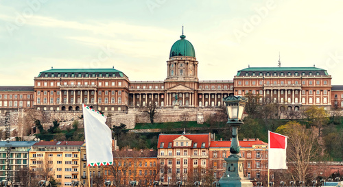 Buda Castle at sunset with warm cloudy sky © frimufilms