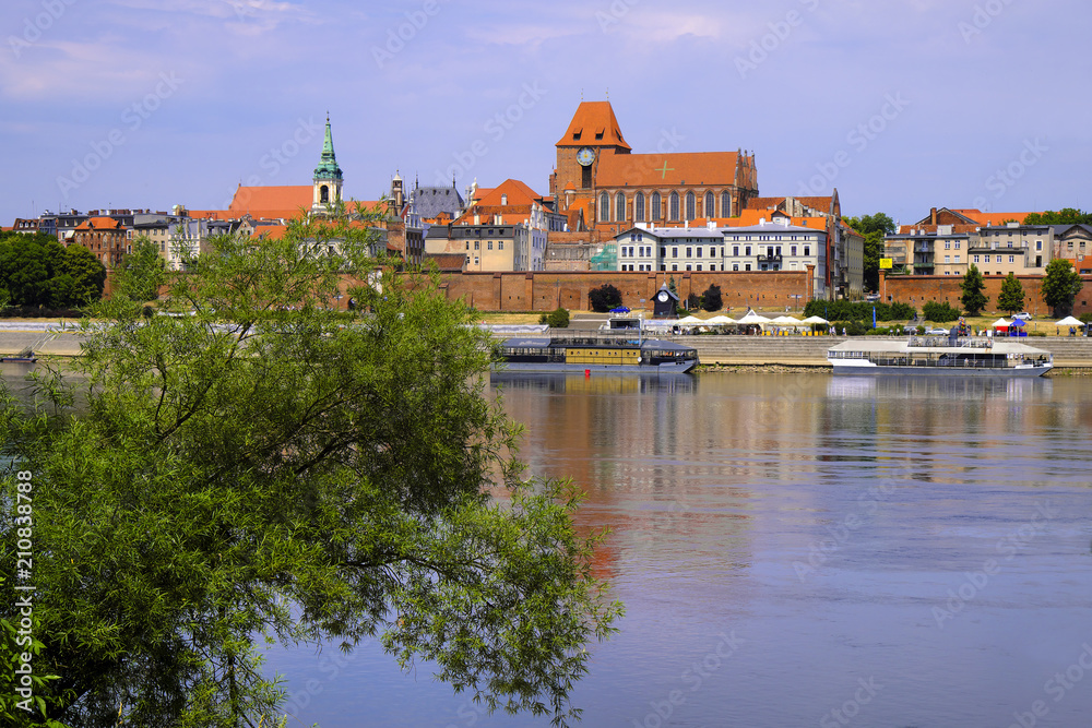 Naklejka premium Torun, Poland - Panoramic view of historical district of Torun old town by the Vistula river