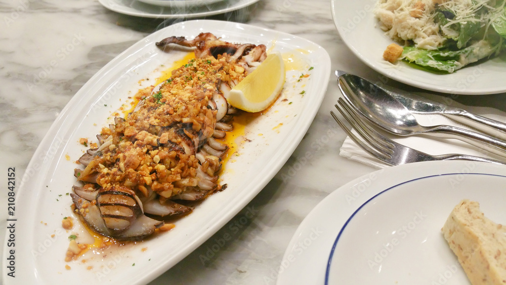 Grilled squid with lemon and sweet and sour Grilled squid with lemon and sweet and sour