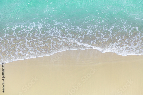 Soft wave of blue ocean on sandy beach. Empty blue sea. View of nice tropical beach Horizon with Cream color sand . Holiday and vacation concept.