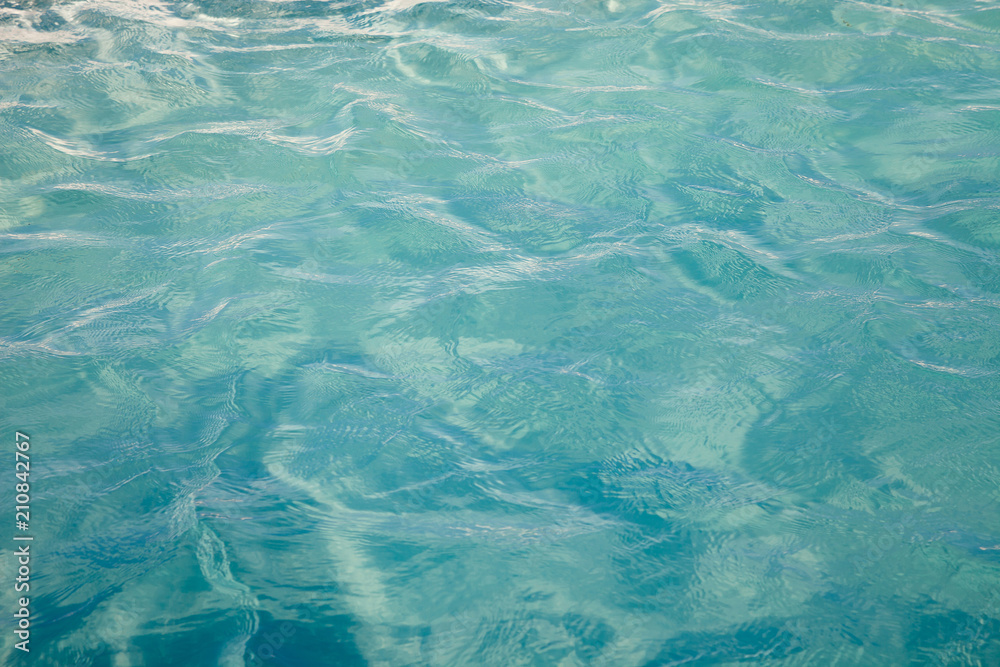 Blue sea ocean water background .Tropical Pattern blue ripple curl water in swimming pool .