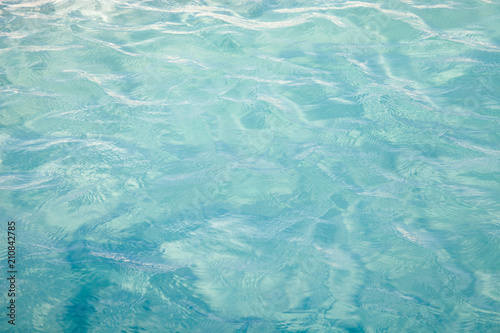 Blue sea ocean water background .Tropical Pattern blue ripple curl water in swimming pool .