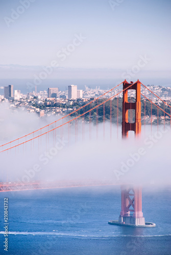 San Francisco Golden Gate bridge on foggy day dramatic evening light view from Marin Headland side photo