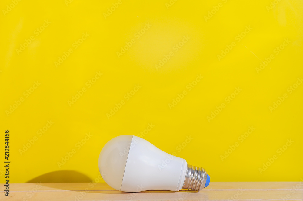 Light bulb on yellow background with copy space.Bright and fresh idea concept. Light bulb on yellow background with copy space.Bright and fresh idea concept.