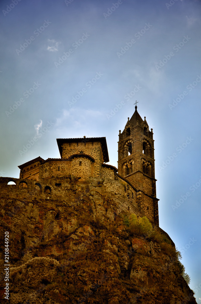 Ancient Chapel Saint Michel de Aiguilhe standing at a very steep volcanic needle (Le Puy en Velay, France)