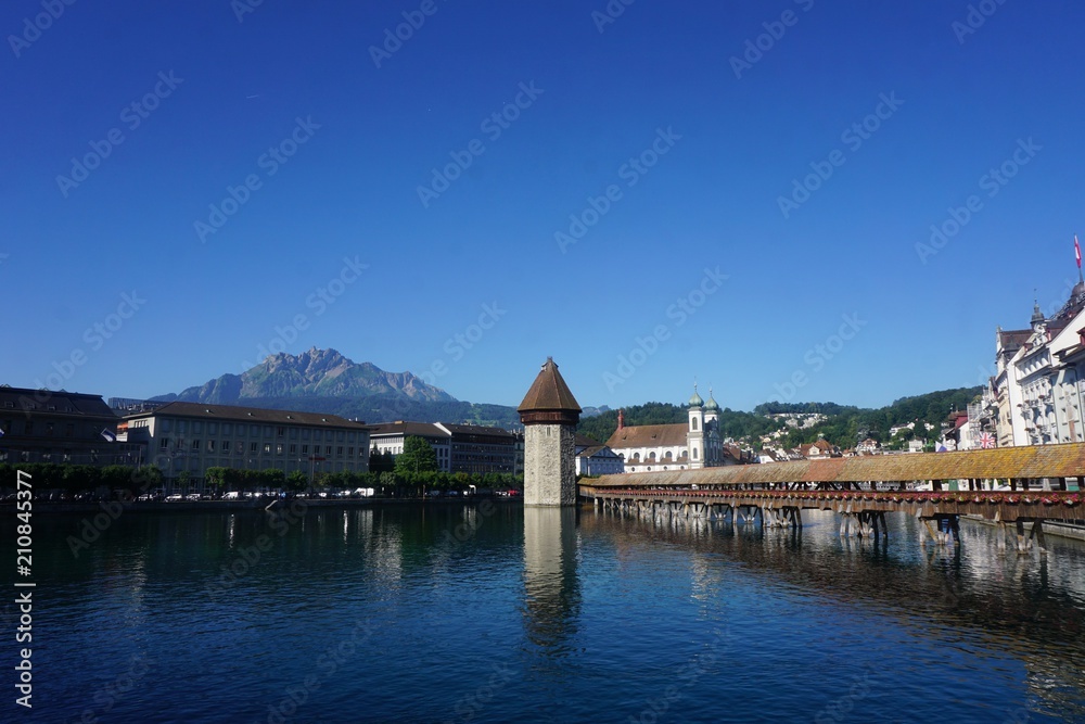 Water tower in Switzerland town at a lake