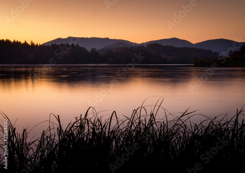 Sun setting view by lake