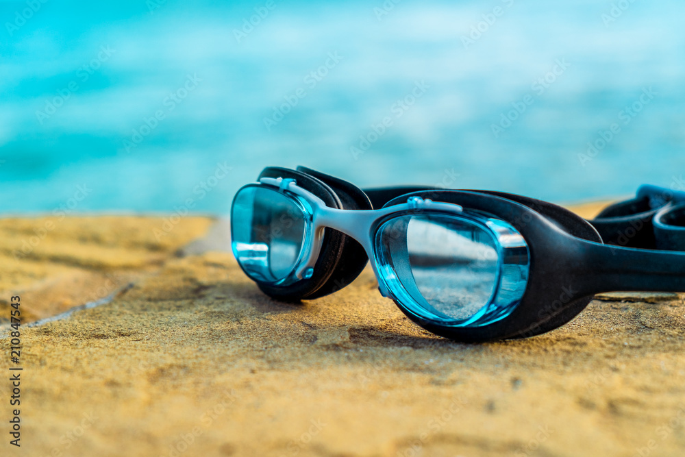 Blue diving glasses on the beach