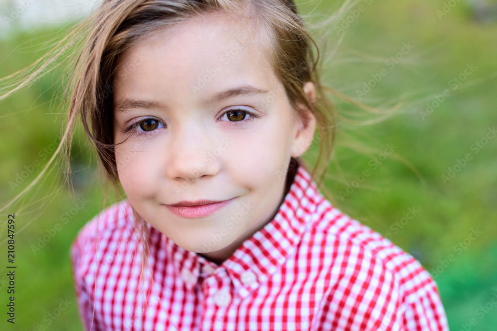 Close up portrait of smiling little child on blurred background Close up portrait of smiling little child on blurred background