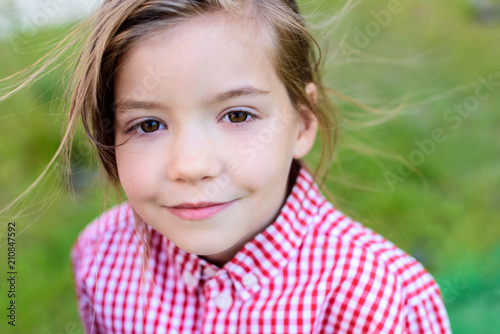 Close up portrait of smiling little child on blurred background