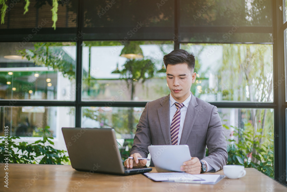 Portrait Young businessman. Young business man working at a coffee shop. Young business man stressed Portrait Young businessman. Young business man working at a coffee shop. Young business man stressed