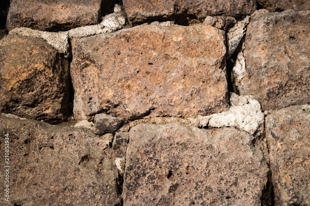 Detail of an old wall with bricks and cement Detail of an old wall with bricks and cement