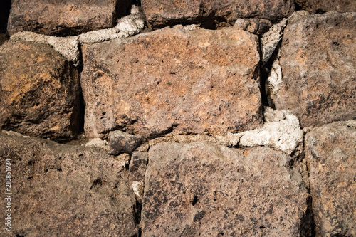 Detail of an old wall with bricks and cement