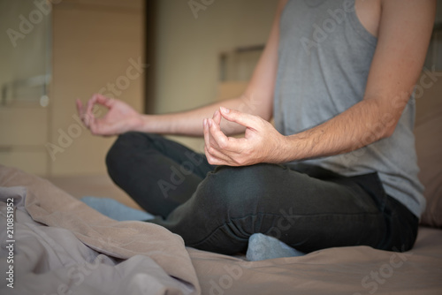 Meditate on the bed before sleep everyday , meditation before bed, to get a better night's sleep, healthy concept. photo