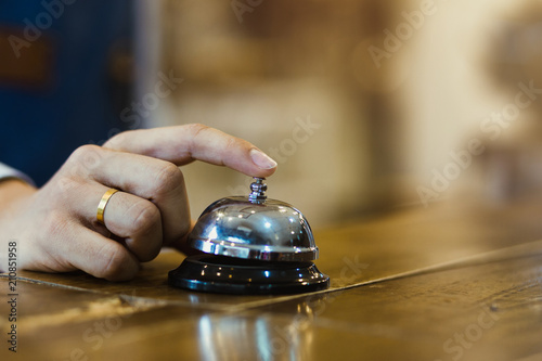 Close-up Finger press bell. Restaurant bell