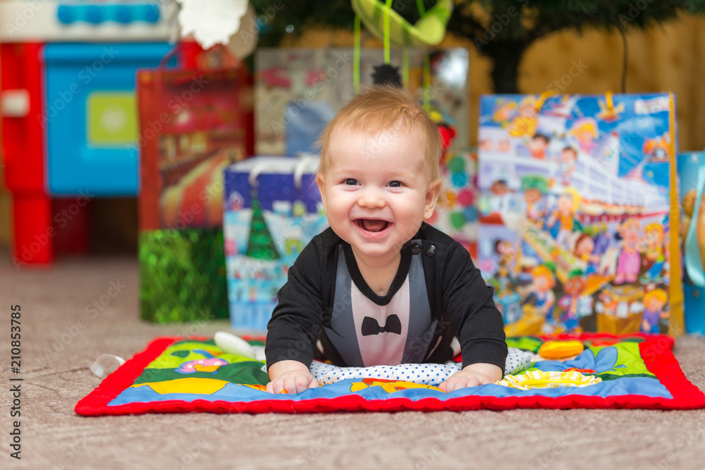 Smiling little child lying on the carpet Smiling little child lying on the carpet