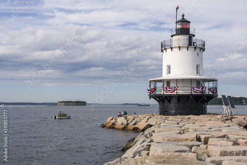 Lobsterman Passes By Spring Point Lighthouse in Maine
