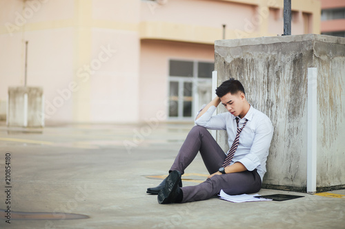 Young businessmen are stressed out of work, Young unemployed businessman