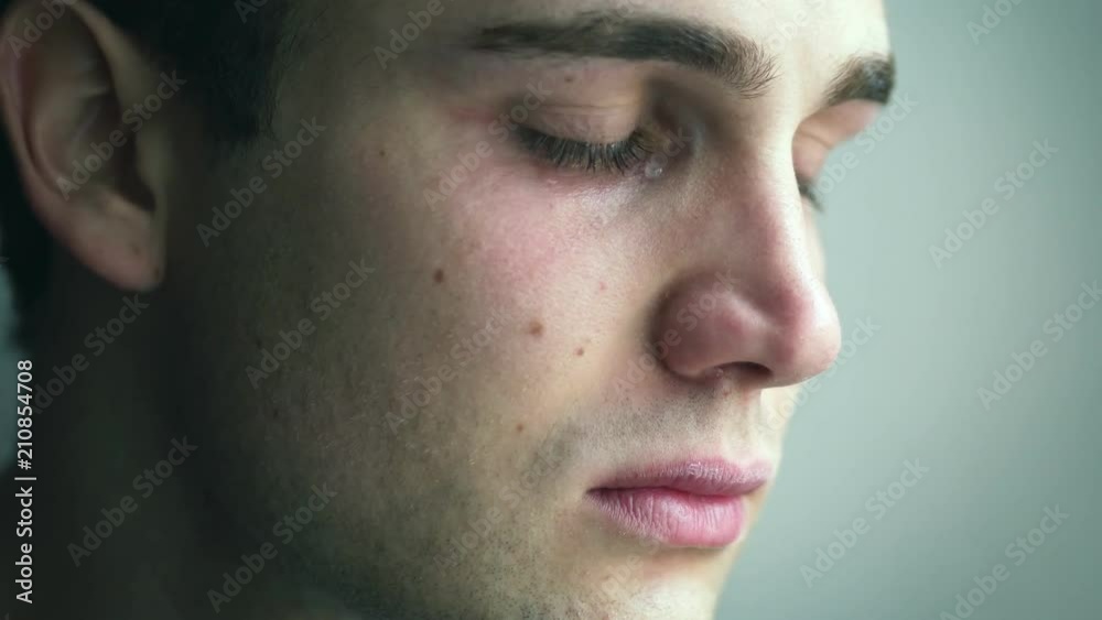young attractive man sad cries. Broken heart, disappointment, suffering young attractive man sad cries. Broken heart, disappointment, suffering