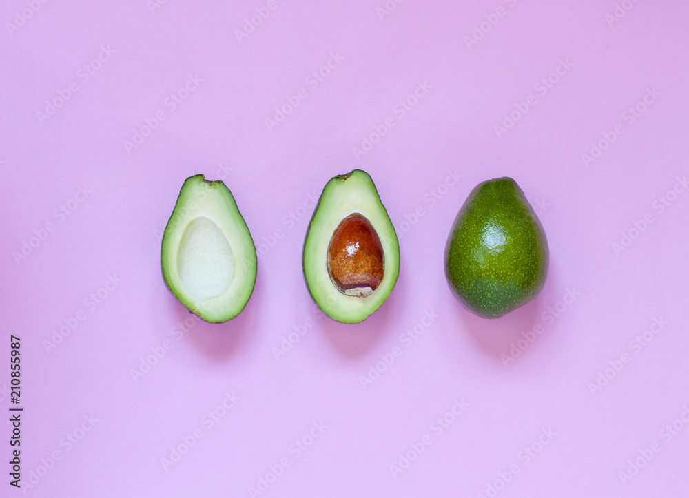 Avocado on the pink background. Top view Avocado on the pink background. Top view