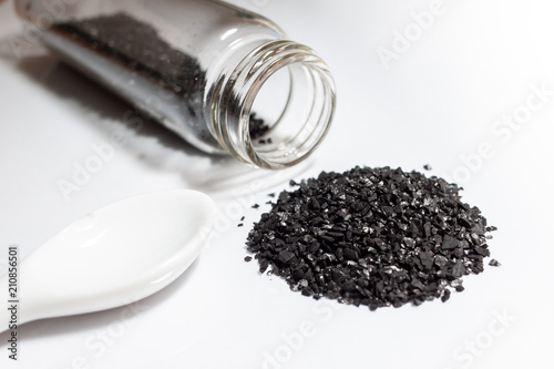 activated carbon or granular in clear bottle is used in air purification, decaffeinate, gold purification, metal extraction, water purification, medicine, sewage treatment, air filters in gas masks