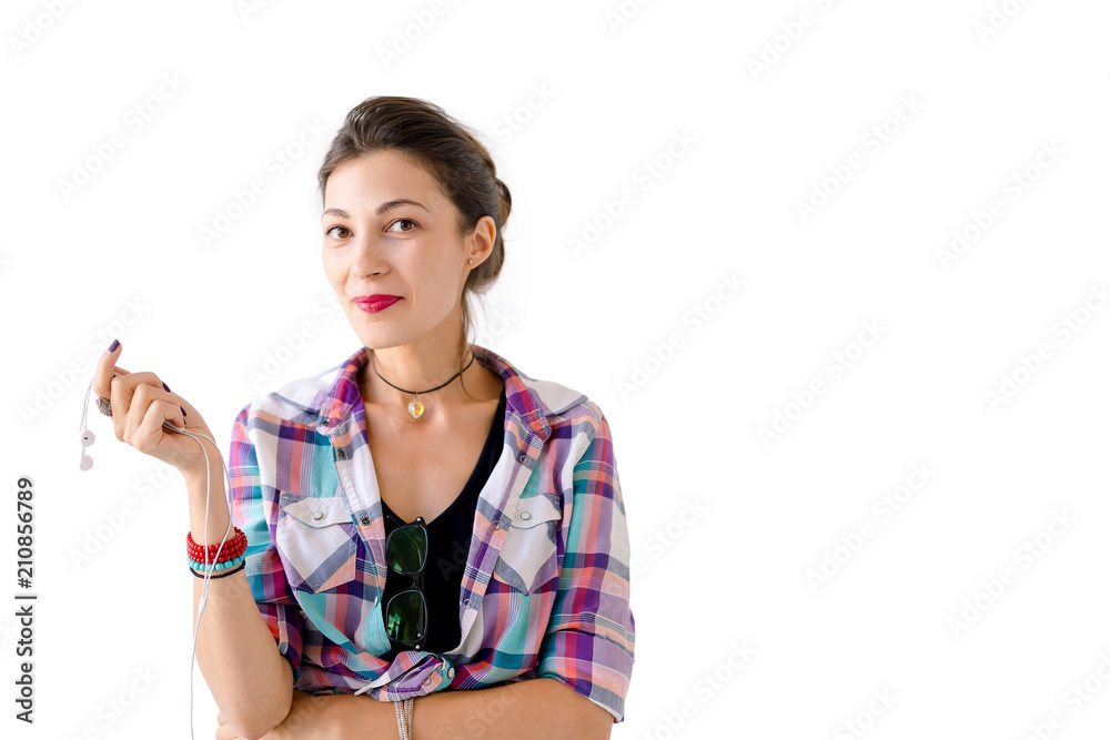 Attractive woman playing with white headphones Attractive woman playing with white headphones