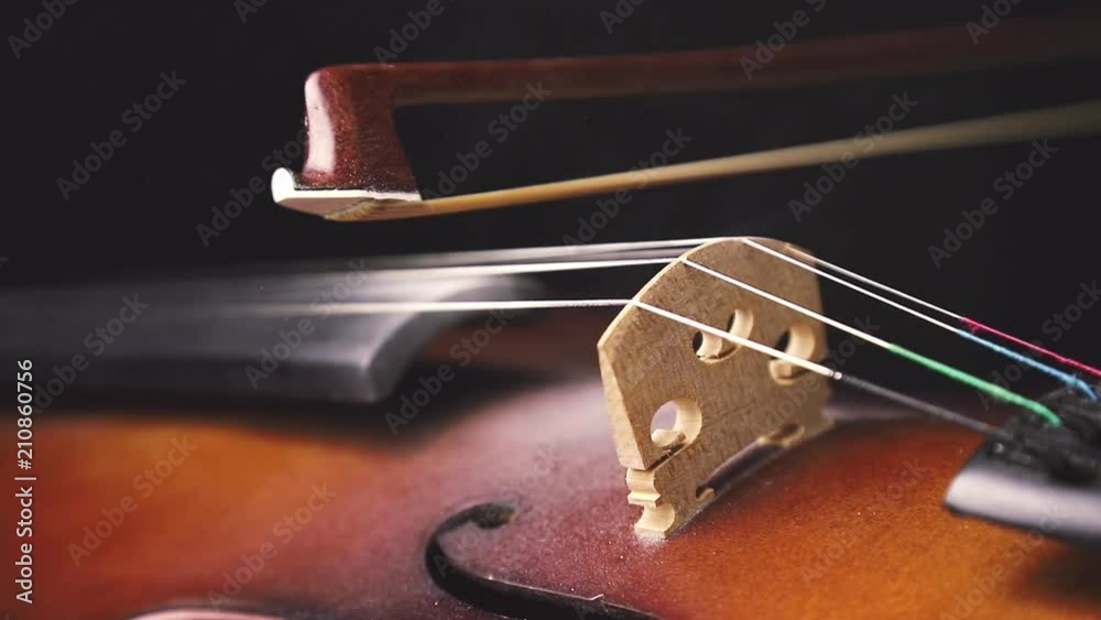 Close up smoke coming out from the violin and bow in the black background, Lowlight, Cinemagraph
