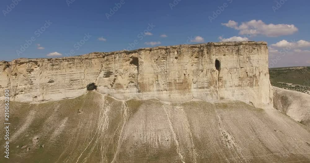 Aerial photography of natural landscape with views of the White Rock mountain in the Crimea against the blue sky . Aerial photography of natural landscape with views of the White Rock mountain in the Crimea against the blue sky .