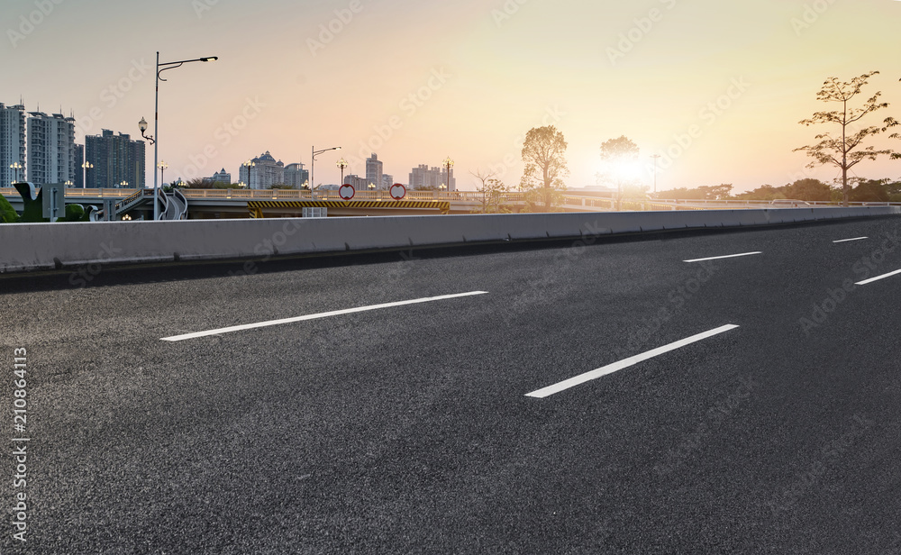 Fototapeta premium Air highway asphalt road and office building of commercial building in modern city