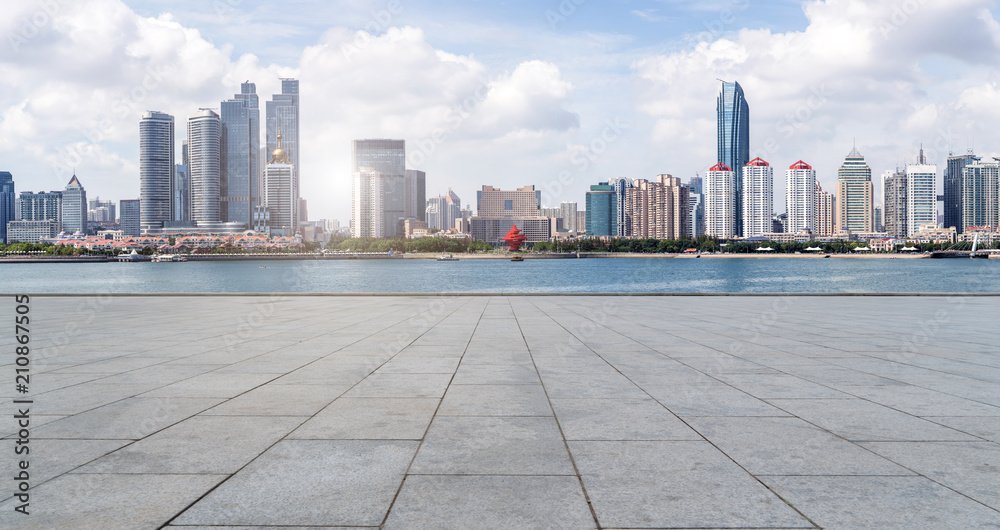 empty marble floor and cityscape of  in blue cloud sky