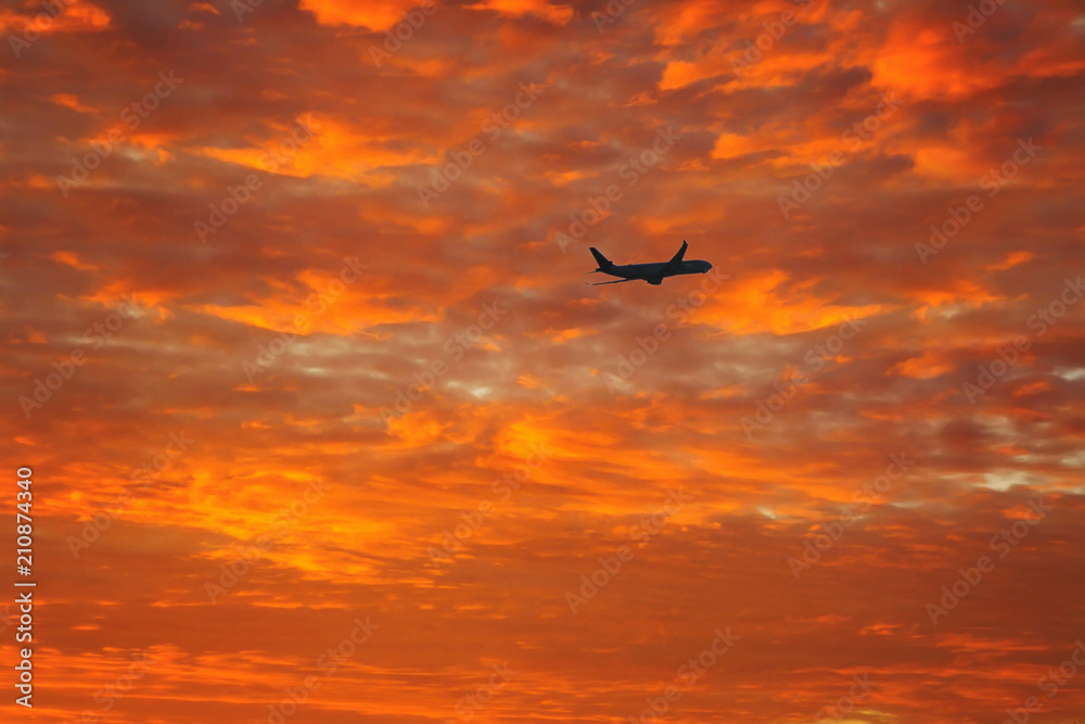 silhouette of airplane on the sunset sky. Canary Islands at sunset. La Gomera