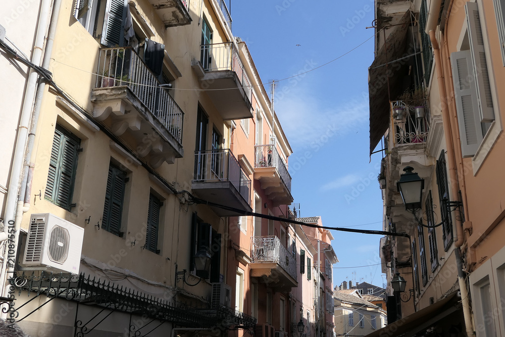 Cityscape of old town part of Corfu town (Greece) with its typical facades and powerlines.