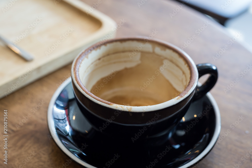 Empty coffee cup after drink on wood table In the coffee shop Empty coffee cup after drink on wood table In the coffee shop