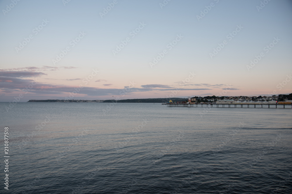 Calm Sea and Pier at Sunset 