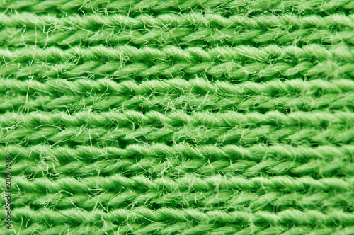 Close-up of texture fabric. Green cloth textile background. Macro