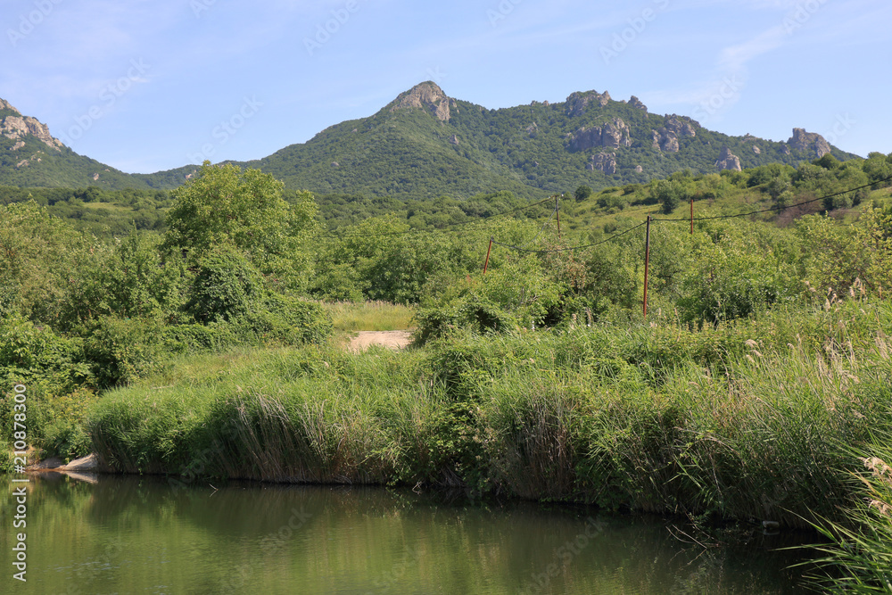 View of the mountain tops from the slope of Mount Beshtau near the small unnamed pond