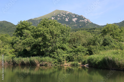 A view of the top of Mount Beshtau from its slope near small unnamed pond. Pyatigorsk, Russia