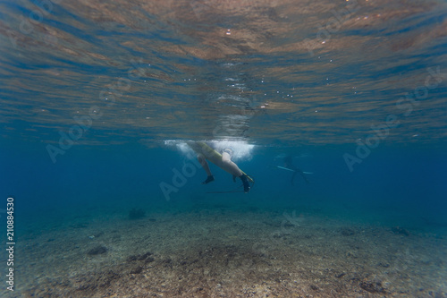 Underwater view of a surfer