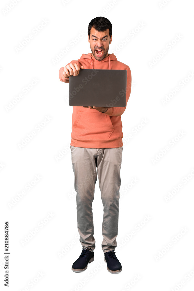 Full body of Man in a pink sweatshirt with laptop Full body of Man in a pink sweatshirt with laptop