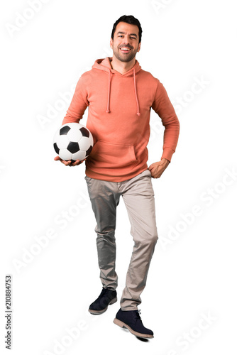 Full body of Man in a pink sweatshirt with soccer ball