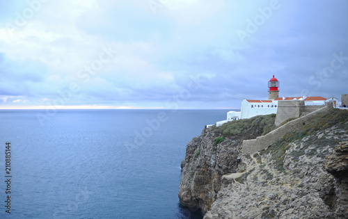 Amazing lighthouse on cliffs at Cape St. Vincent. Algarve, Portugal. The most extreme geographical point in the southwest of Continental Europe