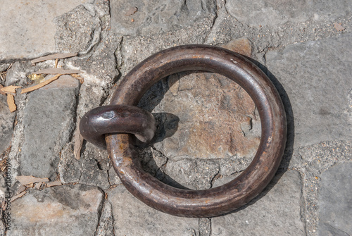 Fotografie Iron ring on the cobblestone floor on the banks of the Seine in Paris