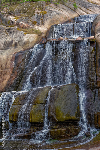 Putouskallio rock with an artificial waterfall in Sapokka Water Garden. Kotka, Finland. photo