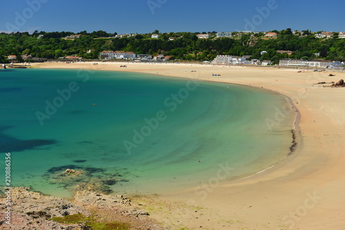 Fototapeta Naklejka Na Ścianę i Meble -  St Brelades Bay, Jersey, U.K. The white sands and aquamarine waters of the most popular beach in the Channel Islands.
