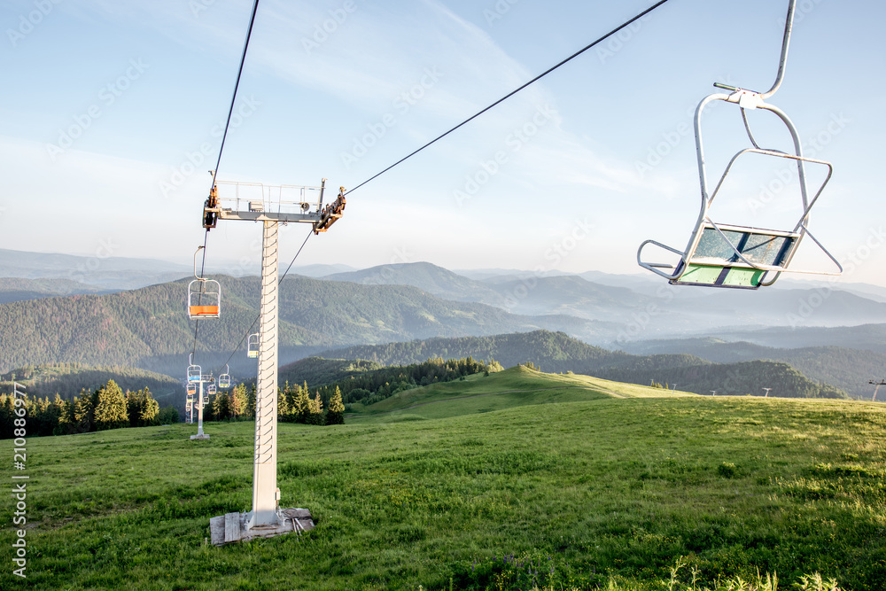 Landscape view on the beautiful Carpathian mountains with ski lift on the High Top near the Slavske village during the sunrise in Ukraine