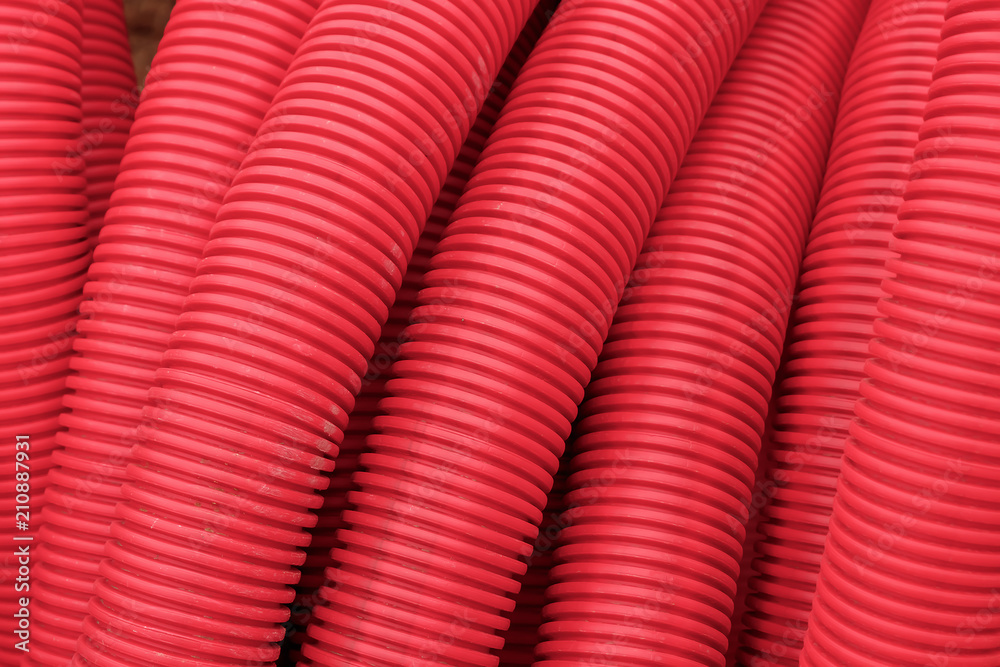 red plastic pipes for electric wires