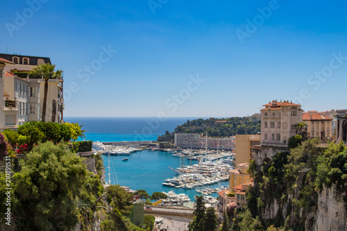View of Monaco City with boat marina below in Monaco. Monaco City is one of the four traditional quarters.