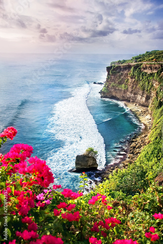Picturesque bright cliff landscape Uluwatu Bali, Indonesia. Sightseeing in Indonesia. Sunset in Bali, view of the ocean and the colorful sky, the concept of travel. photo