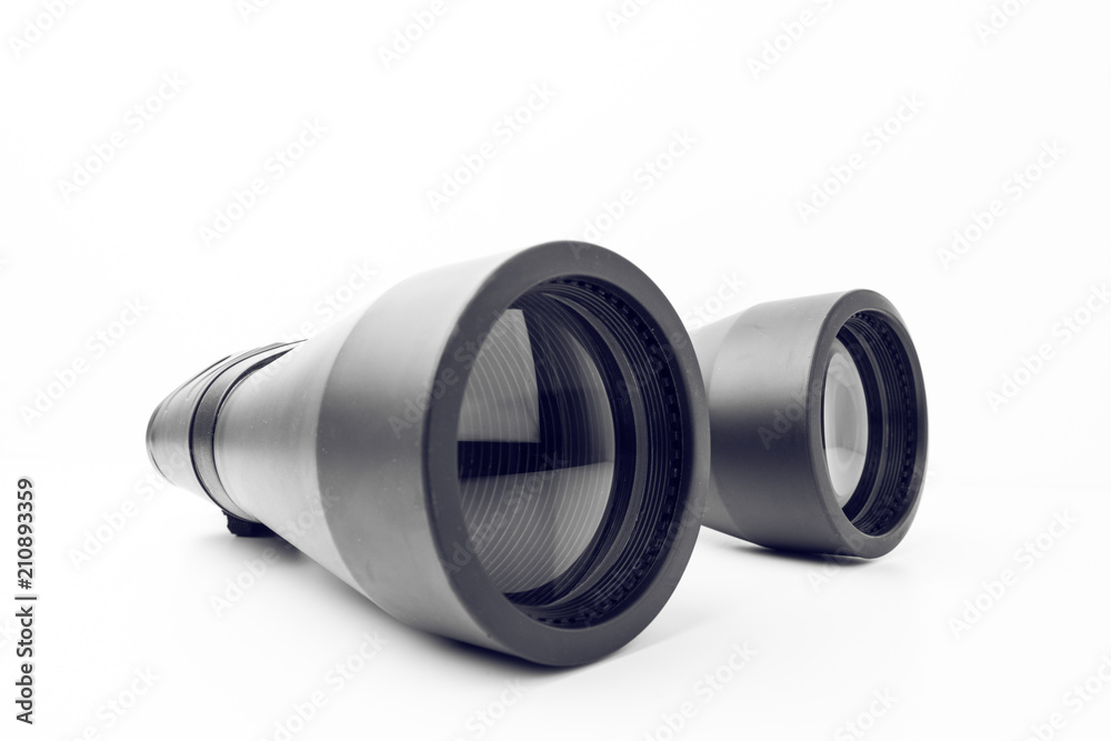 Close Up Of Black Binoculars With Big Reflective Lenses On Plain White Background Close Up Of Black Binoculars With Big Reflective Lenses On Plain White Background